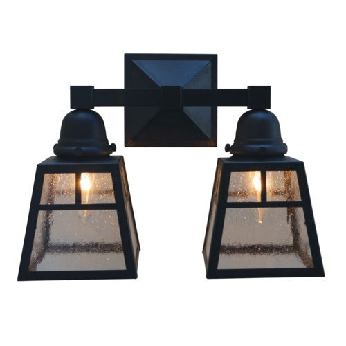 Pair of black outdoor wall lights with glass panels on a white background