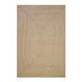 Beige braided rug on a white background
