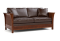 A two-seater sofa with dark brown leather cushions and a medium brown wooden frame, shown from a three-quarter angle on a white background.