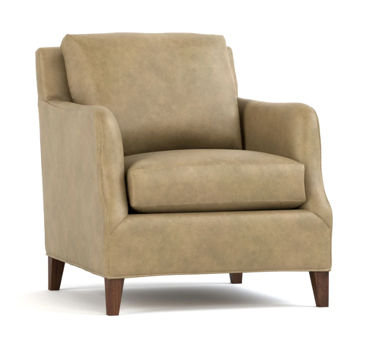 A classic armchair upholstered in a textured tan fabric with dark brown wooden legs, shown from a three-quarter angle on a white background.