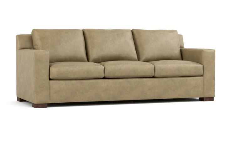 A three-seat upholstered sofa in a warm taupe-beige fabric, shown from a front three-quarter angle on a white background.