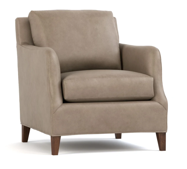 A classic armchair upholstered in a textured taupe fabric with dark brown wooden legs, shown against a plain white background.