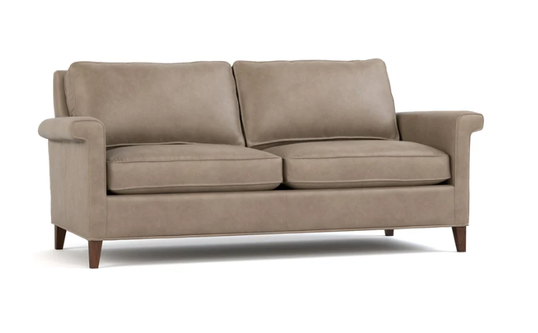A two-seater loveseat sofa upholstered in a textured taupe fabric, featuring dark brown wooden legs, shown against a plain white background.