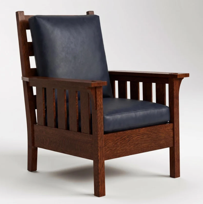 A classic wooden armchair with a dark reddish-brown frame and deep navy blue cushions on the backrest and seat, photographed against a neutral light gray background.