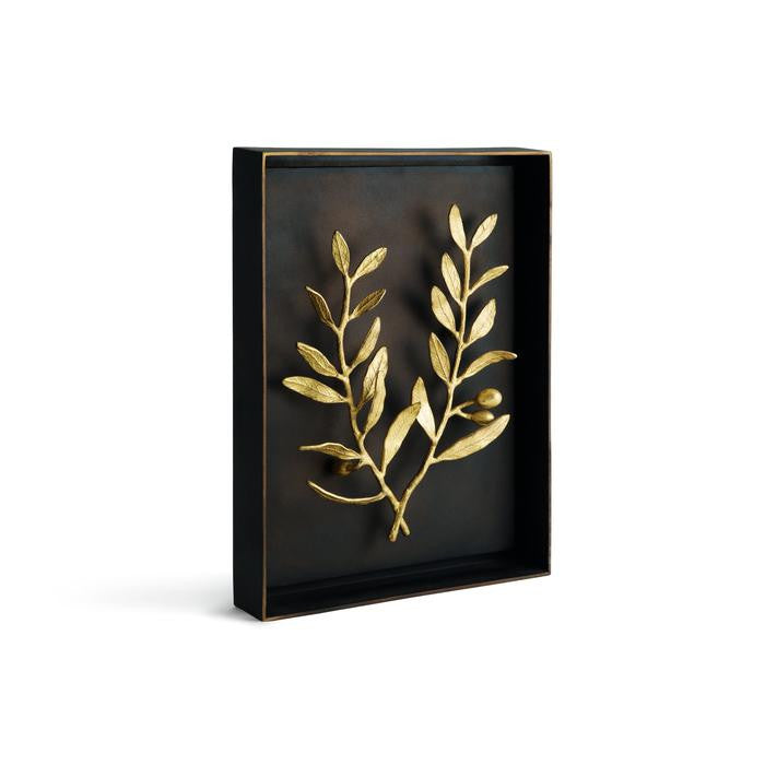 Decorative wall art with gold leaf design on a black background