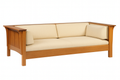 Wooden sofa with beige cushions on a white background