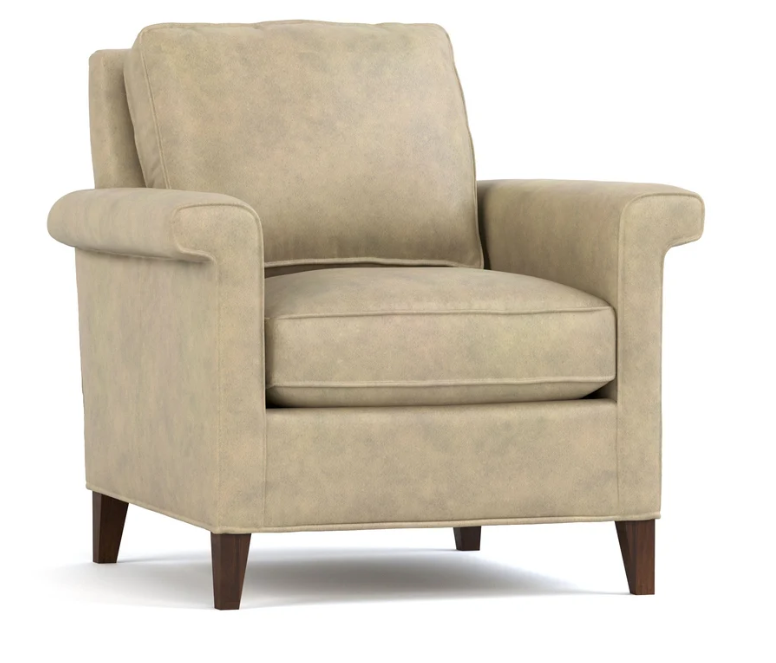 A classic upholstered armchair in a warm beige fabric, featuring dark brown wooden legs, shown against a plain white background.