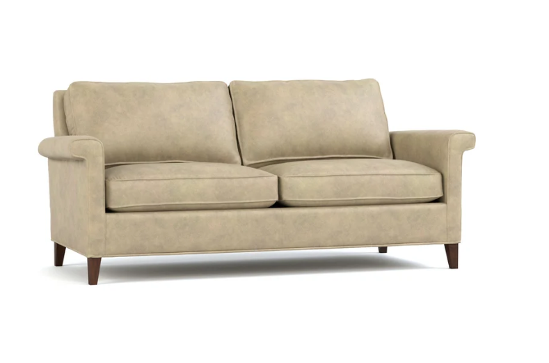 A two-seater loveseat sofa upholstered in a textured beige fabric, featuring dark brown wooden legs, shown against a plain white background.