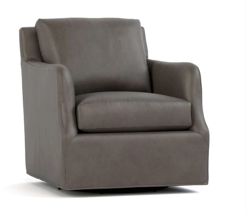 A dark gray upholstered armchair with a high back, wide armrests, and a cushioned seat, shown on a plain white background.