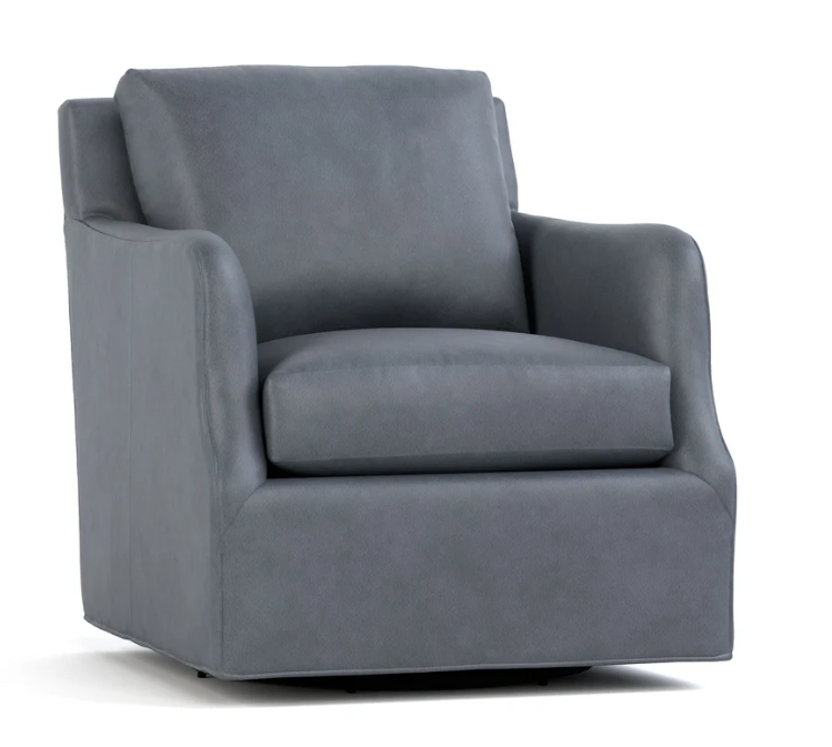 A dark gray upholstered armchair with a high back, wide armrests, and a cushioned seat, shown on a plain white background.