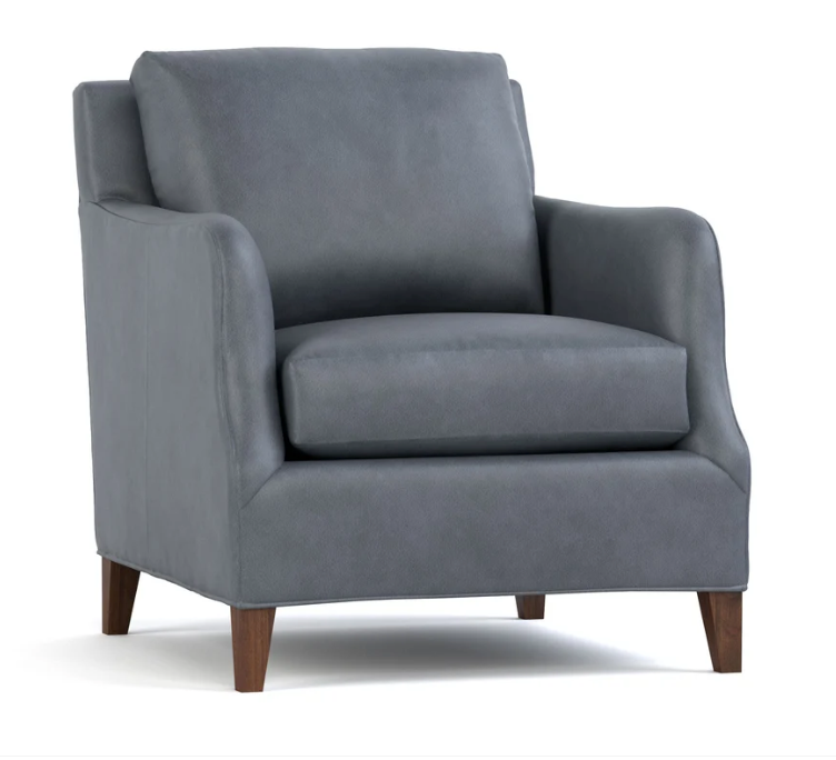 A modern gray upholstered armchair with dark brown wooden legs, shown from a three-quarter angle on a white background.