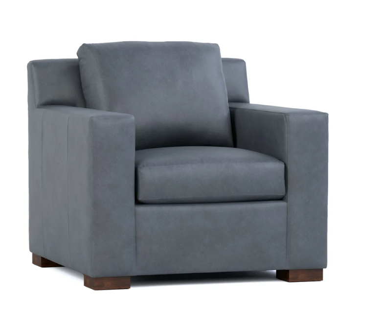 A modern gray upholstered armchair with a high back, square arms, and dark wood feet, shown against a plain white background.