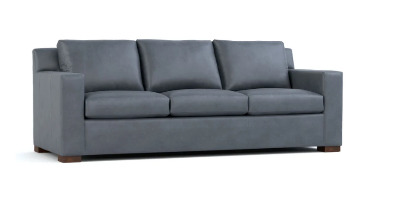 A three-seat gray upholstered sofa with square arms, three loose back cushions, and two loose seat cushions, shown on a plain white background.