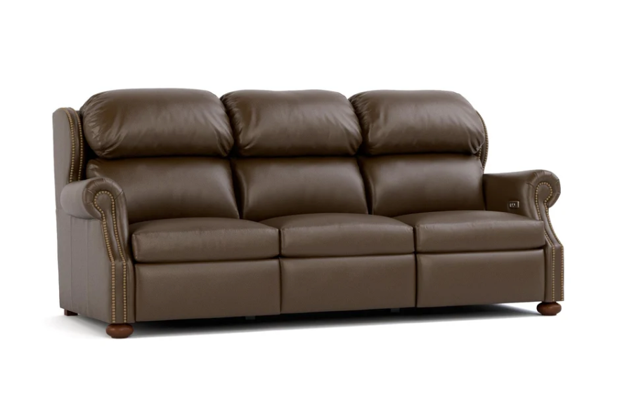 A three-seat brown leather reclining sofa with rolled arms, nailhead trim, and dark wooden legs, shown on a plain white background.