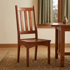 Wood dining chair in a warm Arts and Crafts dining room